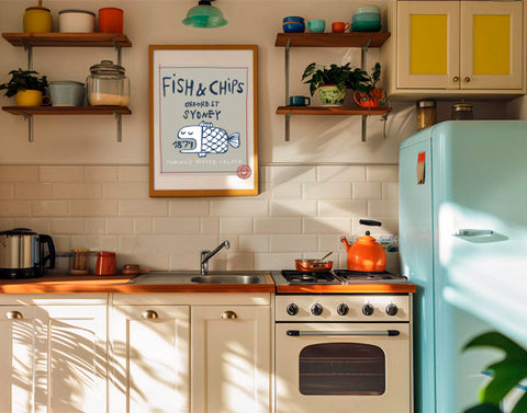 a framed Art print about Fish & chips hanging on the kitchen´s wall