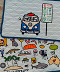 reversible textile placemat with bold and colourful icons of Australia