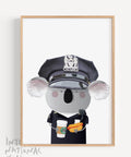 framed print with an illustration of a Koala wearing the New York City Police black uniform, eating a hot dog and having a take away coffee