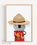 A framed souvenir print featuring a koala dressed as a member of the Royal Canadian Mounted Police, holding a maple leaf and a jar of maple syrup, designed for Canadians in Australia