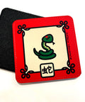 Coaster with illustration of the  Snake Chinese Zodiac sign with a red border and its name in Chinese